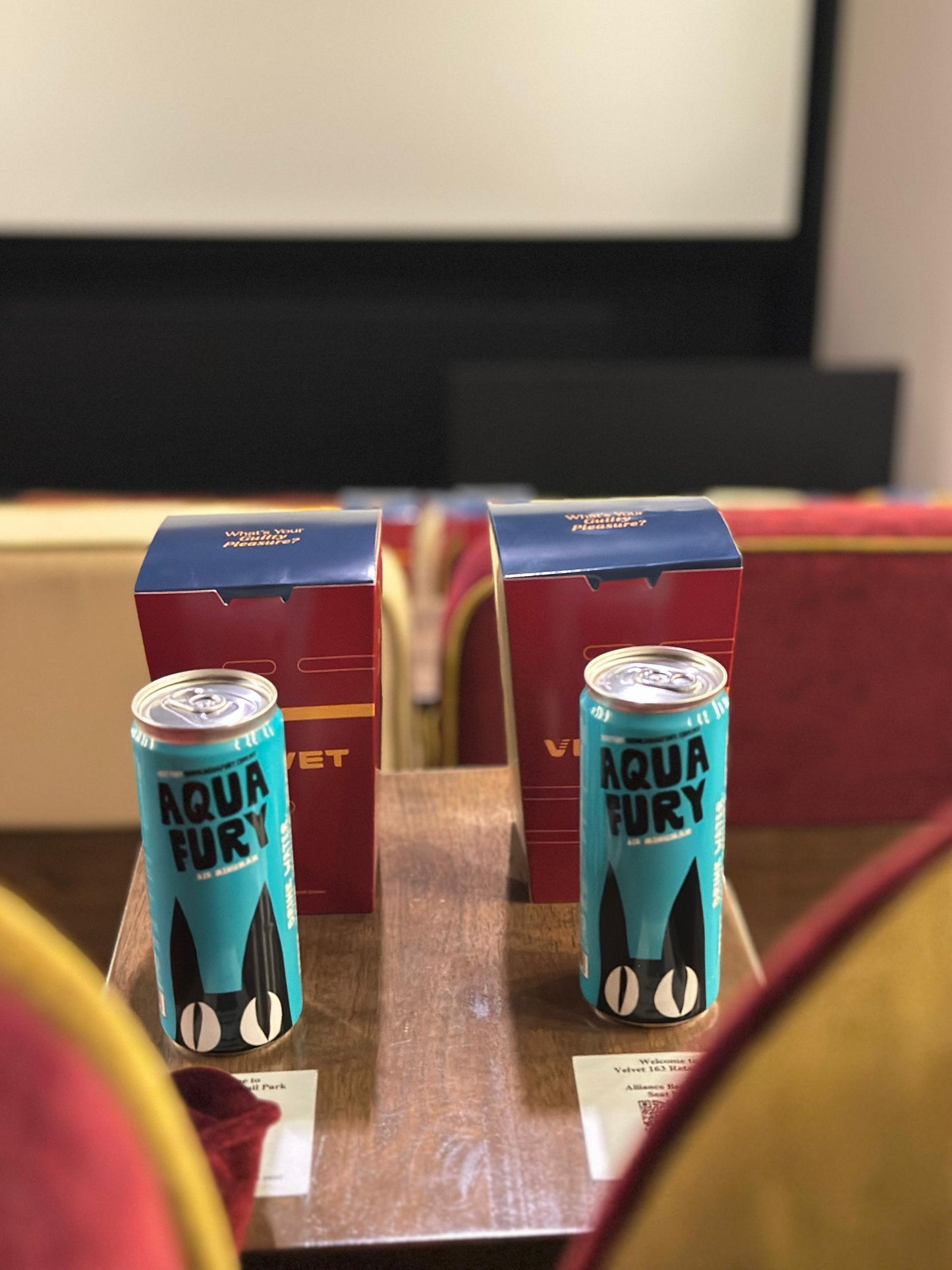 Two cans of 'Aqua Fury' with Popcorns